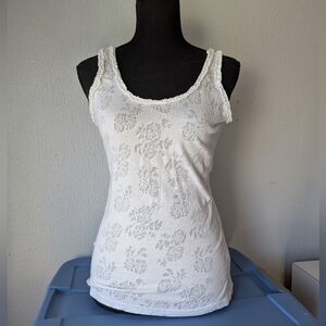 White floral lace tank top with ruffled trim on collar